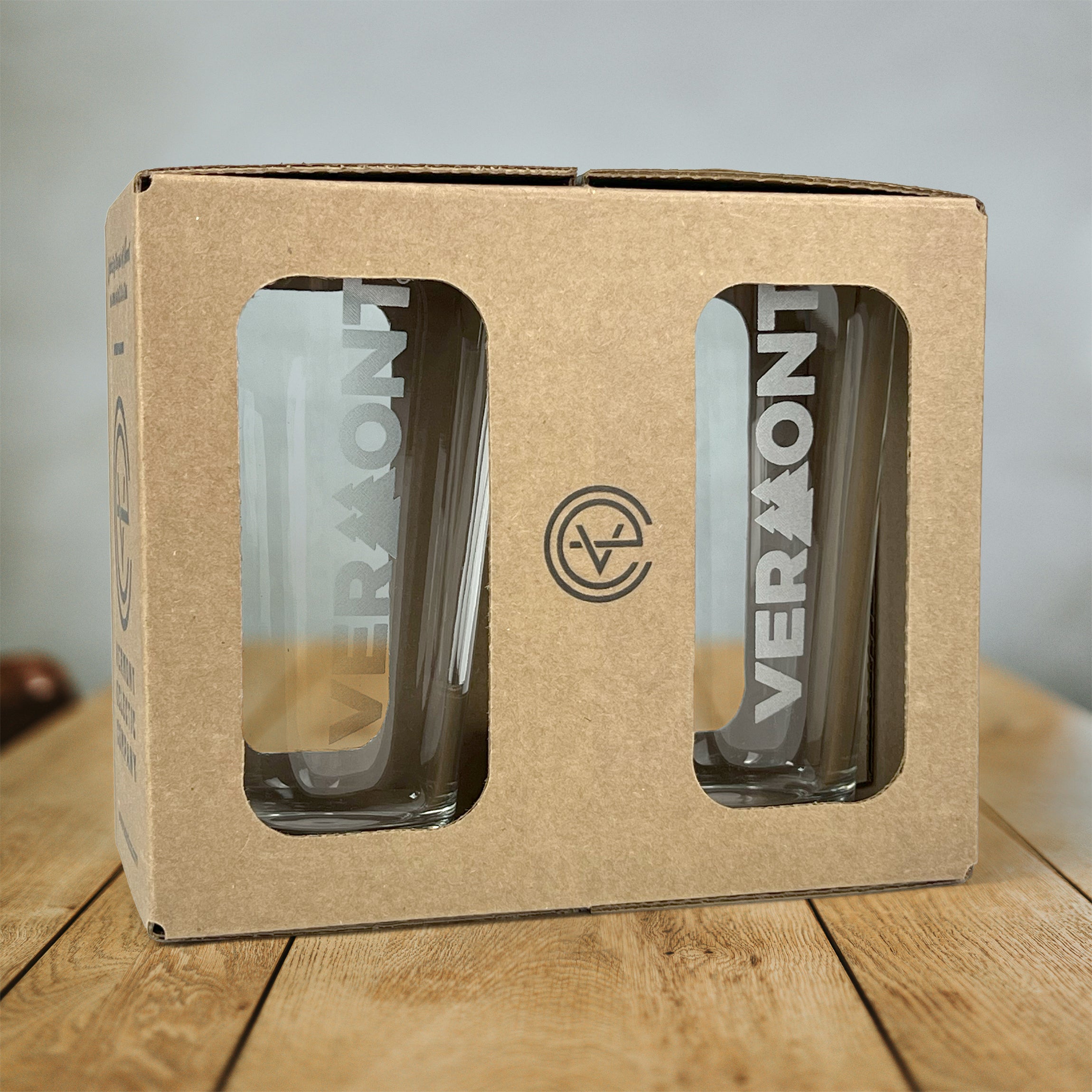 Box with two pint glasses with Pining for Vermont artwork etched vertically on front of glasses
